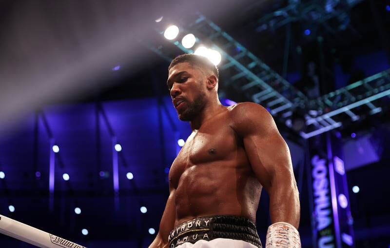 A dejected Anthony Joshua walks back to his corner. Getty