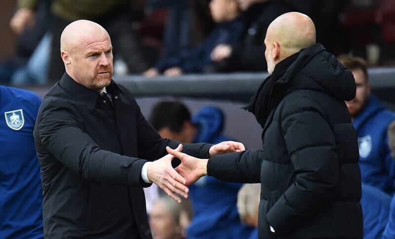 Burnley manager Sean Dyche and Pep Guardiola shake hands after the match. EPA