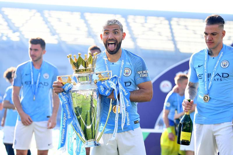 BRIGHTON, ENGLAND - MAY 12: Sergio Aguero of Manchester City  celebrates with the Premier League Trophy after winning the title following the Premier League match between Brighton & Hove Albion and Manchester City at American Express Community Stadium on May 12, 2019 in Brighton, United Kingdom. (Photo by Michael Regan/Getty Images)