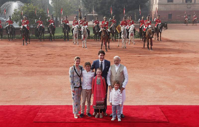 Mr Trudeau, his wife, their daughter, Ella Grace, and their sons, Xavier and Hadrien, pose for photographers with Mr Modi during the ceremonial reception for the Canadian prime minister. Adnan Abidi / Reuters