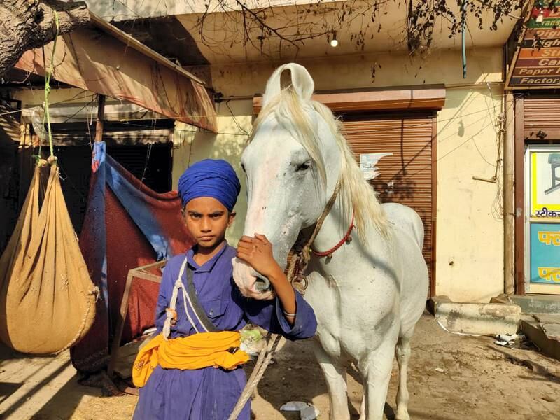 Fateh Singh, 14, is a young Nihang Sikh warrior. The teenager is stationed at Singhu border along with hundreds of Nihangs, a 17th century warrior order, in support of agitating farmers. Taniya Dutta for The National