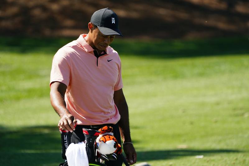 Tiger Woods pauses while hitting on the driving range at Augusta National Golf Club. AP