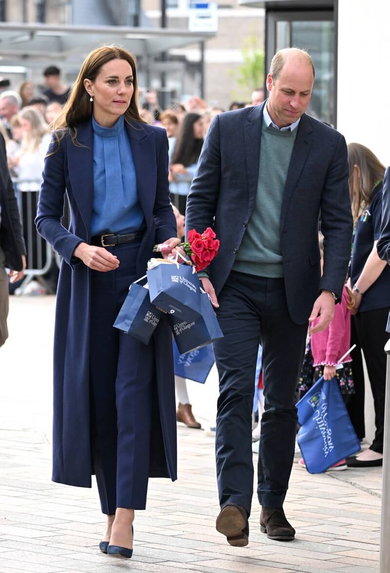A twist on the suit, Kate wore a violet Catherine Walker duster coat in place of a blazer, with co-ordinated trousers and a blue Cefinn blouse to speak to students at the University of Glasgow on May 11, 2022. WireImage