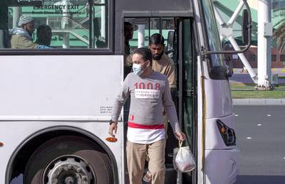 Abu Dhabi, United Arab Emirates, March 5, 2020.  A worker with a face mask disembarks from a bus at the Abu Dhabi Main Bus Terminal area.   FOR:  standaloneVictor Besa / The NationalSection:  NA
