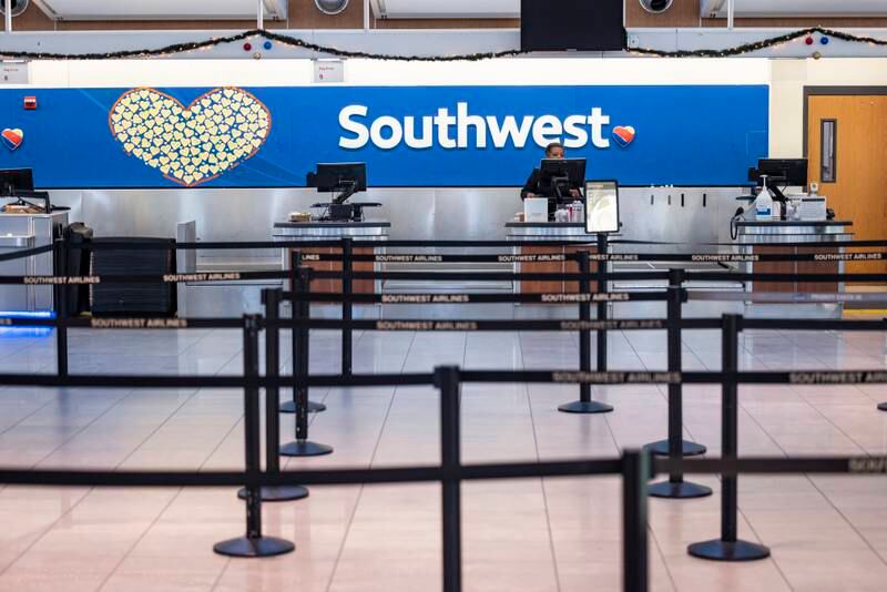 Passengers were scarce at the Southwest Airlines check-in  counter at Baltimore Washington International Airport after the carrier cancelled another 3,000 flights for the day. EPA