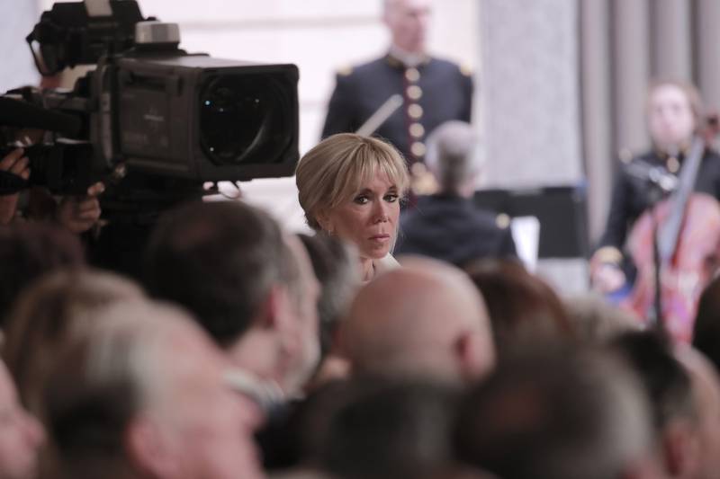 Brigitte Macron, wife of French President Emmanuel Macron, listens to her husband's speech. AP Photo