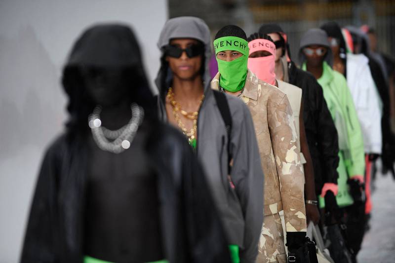 Models present a creation by US fashion designer Matthew Williams during the Givenchy menswear spring/summer 2023 at Paris Fashion Week, on June 22, 2022.  AFP