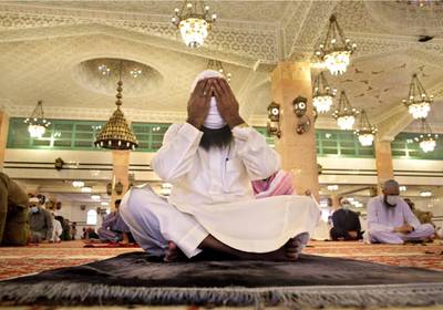 A Saudi worshipper wearing a face mask to prevent the spread of Covid-19, prays at the Al Mirabi Mosque in Jeddah, Saudi Arabia.  AP