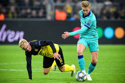 Dortmund's Julian Brandt in action against Barcelona's Frenkie de Jong. EPA