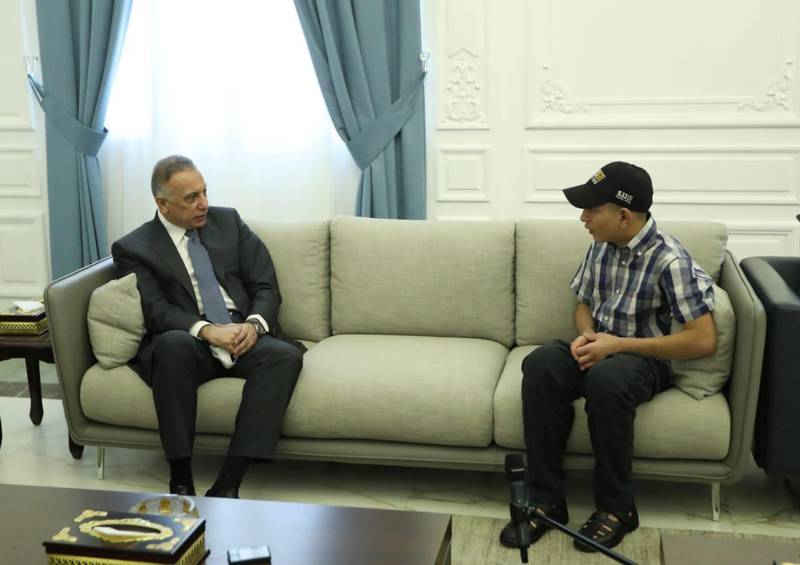 Iraqi Prime Minister Mustafa al-Kadhimi meets with Iraqi teenager Hamid Saeed, who was mistreated by members of security forces, after he was released from jail in Baghdad, Iraq August 3, 2020. Picture taken August 3, 2020.  Iraqi Prime Minister Media Office/Handout via REUTERS ATTENTION EDITORS - THIS IMAGE WAS PROVIDED BY A THIRD PARTY.