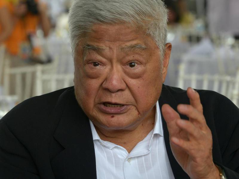John Gokongwei Jr, 86, gestures during a ceremony for Cebu Pacific's  brand-new Airbus A330-300 at Manila's international airport on September 12, 2013. Gokongwei is the fifth richest man in the Philippines, with a net worth of 3.4 billion USD, according to Forbes.  AFP PHOTO / Jay DIRECTO (Photo by JAY DIRECTO / AFP)