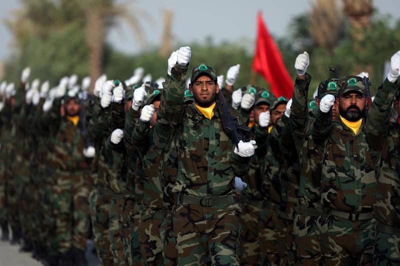Members of the paramilitary Popular Mobilisation Forces (PMF) take part in their graduation ceremony at a military camp in Kerbala, Iraq August 30, 2019. REUTERS/Abdullah Dhiaa Al-Deen
