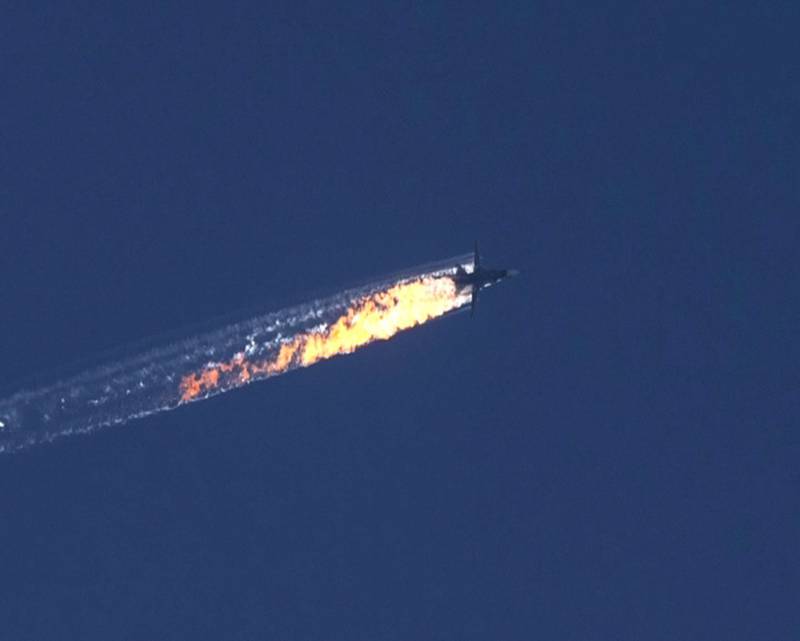 A Russian fighter jet after being shot down near the Turkish-Syrian border. The Sukhoi Su-24 was reportedly downed by Turkish forces, Turkish state news agency Anadolu reported, after the jet encroached into Turkish airspace and ignored warnings. EPA