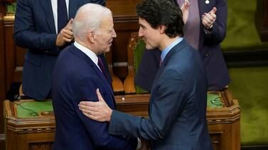 US President Joe Biden shakes hands with Canadian Prime Minister Justin Trudeau at the Canadian Parliament in Ottawa. Reuters