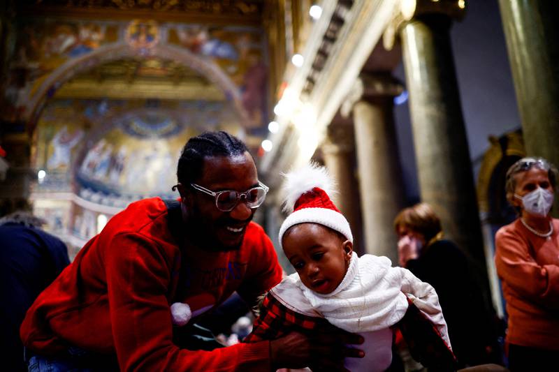 The traditional Christmas lunch for those in need at the Basilica of Santa Maria in Trastevere in Rome. Reuters