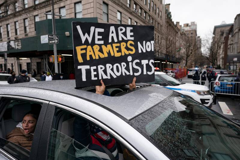 A convoy of protesters drive down Fifth Avenue past the Consulate General of India, Tuesday, Jan. 26, 2021, in the Manhattan borough of New York. Tens of thousands of protesting farmers have marched, rode horses and drove long lines of tractors into India's capital, breaking through police barricades to storm the historic Red Fort. The farmers have been demanding the withdrawal of new laws that they say will favor large corporate farms and devastate the earnings of smaller scale farmers. Republic Day marks the anniversary of the adoption of Indiaâ€™s constitution on Jan. 26, 1950. (AP Photo/John Minchillo)