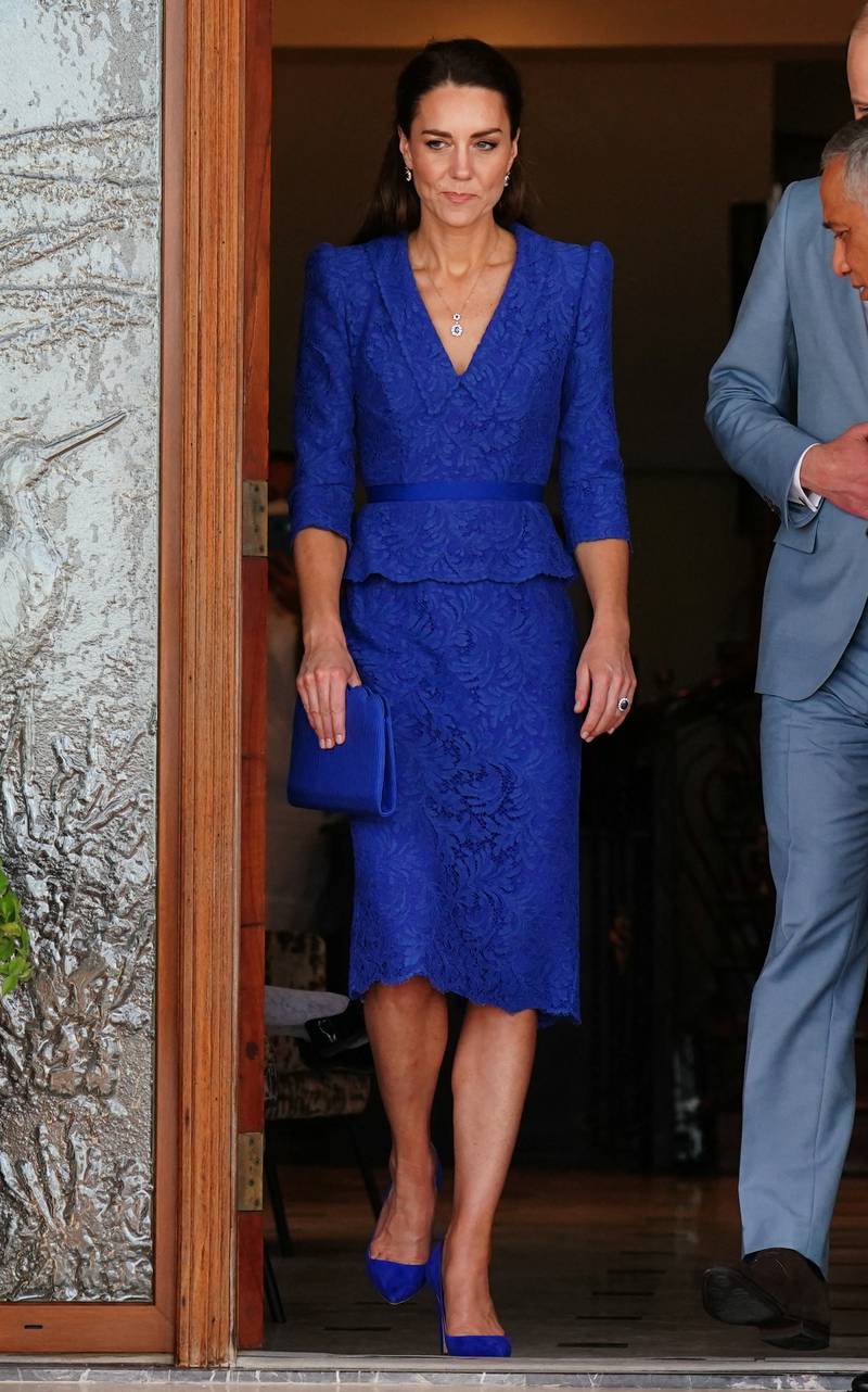 Catherine in a blue lace Jenny Packham dress to arrive in Belize to begin the Royal Caribbean Tour on on behalf of Queen Elizabeth II on March 19. Reuters