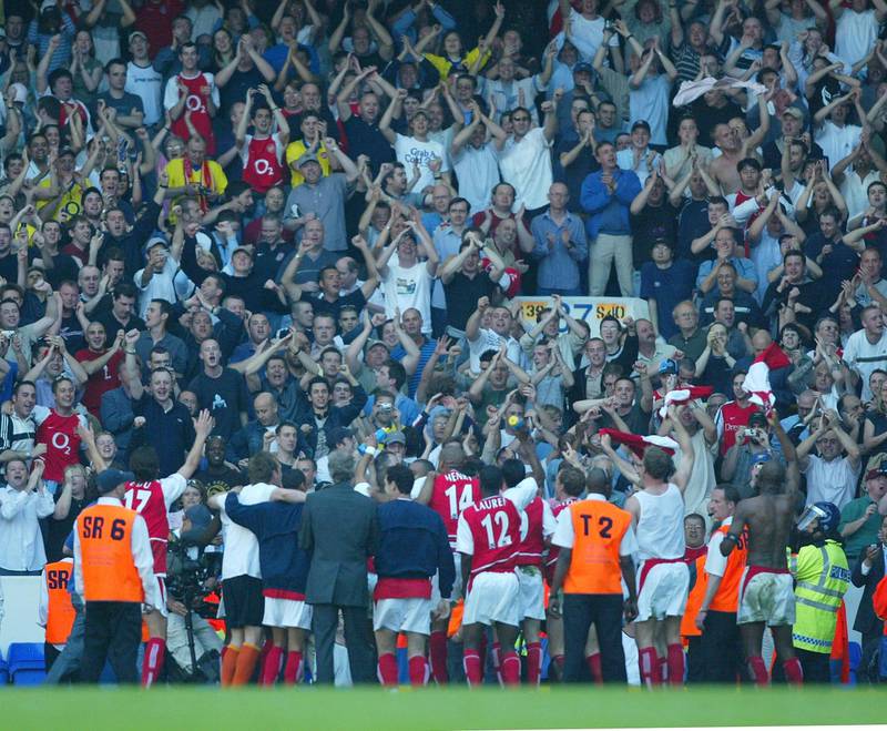 LONDON - APRIL 25:  Arsenal fans applaud their team after winning the Championship in the FA Barclaycard Premiership match between Tottenham Hotspur and Arsenal at White Hart Lane on April 25, 2004 in London.  (Photo by Ben Radford/Getty Images)