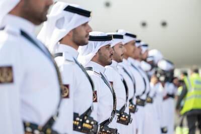 Members of the Qatari honour guard await the arrival of Sheikh Mohamed and his UAE delegation