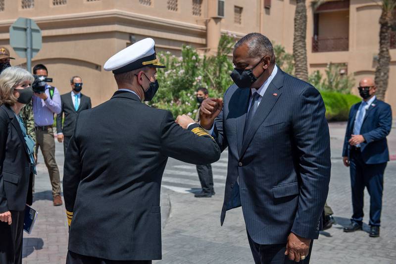 US Secretary of Defence Lloyd Austin is greeted by Vice Admiral  Brad Cooper at the US naval support base in Bahrain. AFP