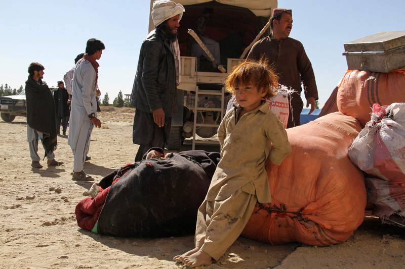 Afghan refugees arrive at a makeshift camp in Ghazni on Tuesday after deportation from Pakistan. AFP