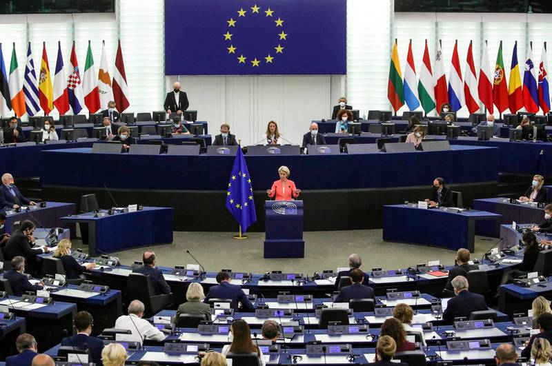 European Parliament members watch Ms von der Leyen deliver her speech on Wednesday. AFP 