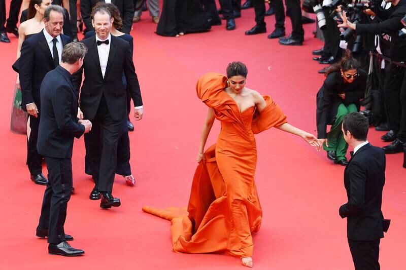 The Bollywood star collaborated again with Lebanese designer Mohammed Ashi's label Ashi Studio wearing a striking orange strapless taffeta gown. Getty Images