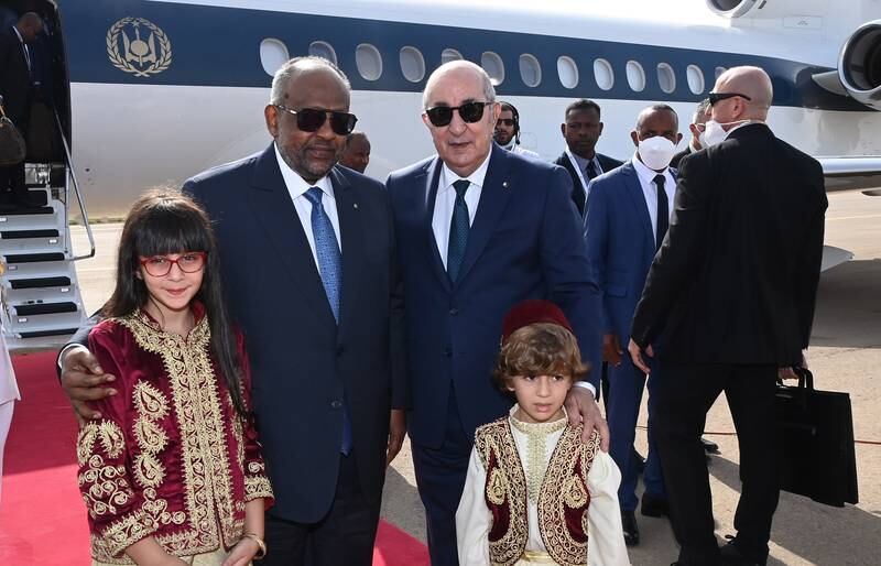 Mr Tebboune, right, welcomes President of Djibouti Ismail Omar Guelleh at Houari Boumediene International Airport in Algiers. EPA
