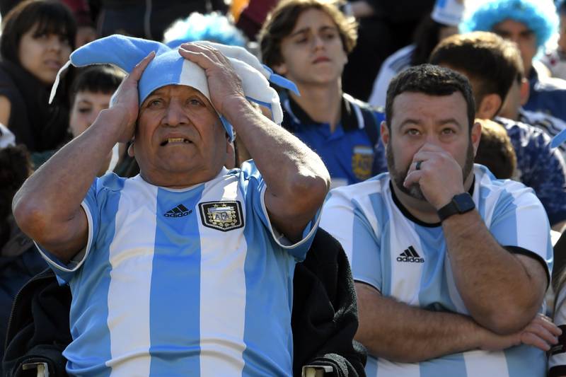 Argentina soccer fans watch the team loose to Saudi Arabia at a World Cup Group C soccer match played in Qatar, on a large screen set up for fans in the Palermo neighborhood of Buenos, Aires. AP