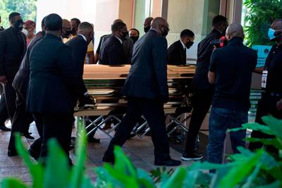 The casket of George Floyd is taken into the Fountain of Praise church in Houston where a public memorial was held on Monday. AFP