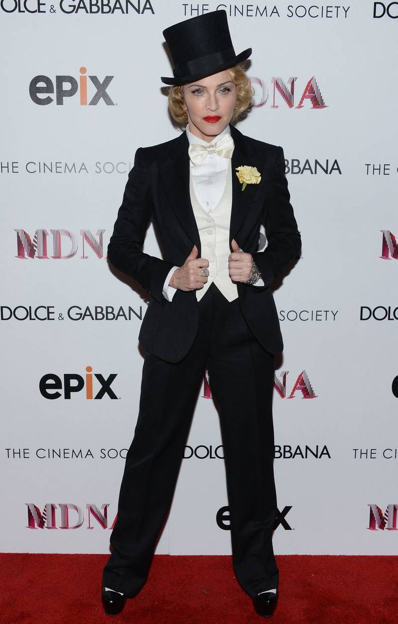 Madonna wore a Tom Ford tuxedo, accessorised with a top hat and flower on her lapel to attend a screening of 'Madonna: The MDNA Tour' in New York City on June 18, 2013. AFP