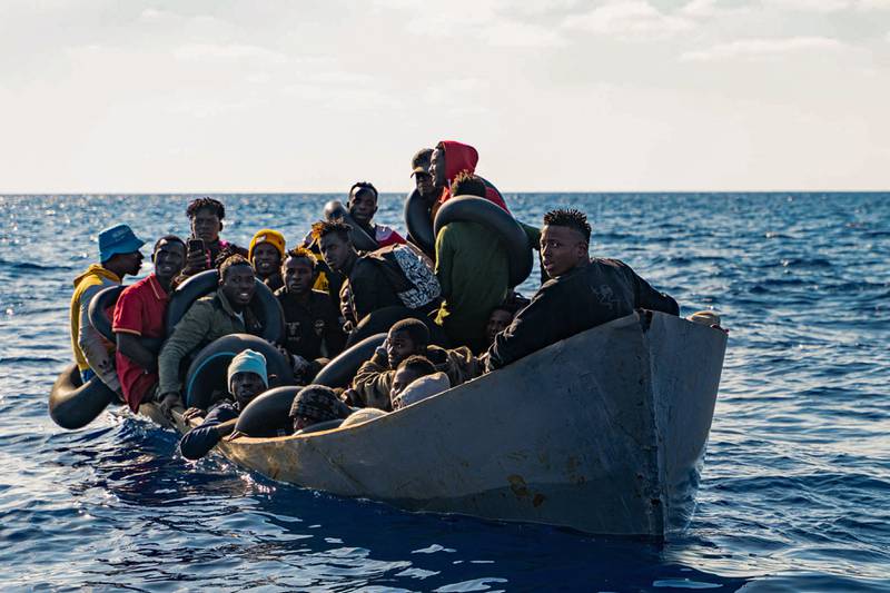 Migrants on a boat off the coast of Sicily, southern Italy. AFP