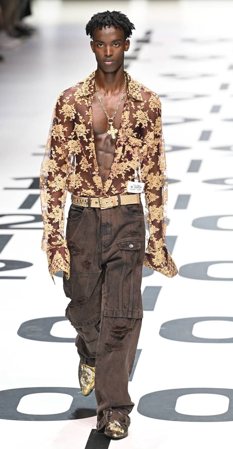 Baggy 1990s-style trousers and lace shirts feature in the Dolce & Gabbana spring/summer 2023 menswear collection. Photo: EPA