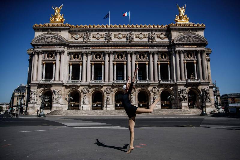 Syrian dancer and choreographer Yara al-Hasbani performs a dance on in front of Paris' Opera Garnier on the 37th day of a strict lockdown in France to stop the spread of COVID-19.  AFP