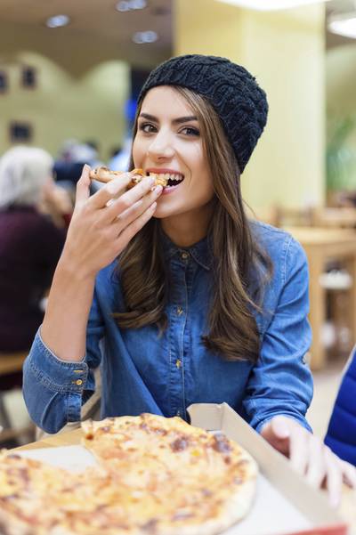Chewing food slowly helps reduce bloating and aids digestion. iStock

