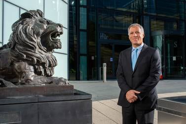 Georges Elhedery, Co-CEO of Global Banking and Markets at HSBC, beside one of the bronze lions in Canary Wharf, London, that guard the entrance to the bank's global headquarters. Mark Chilvers for The National