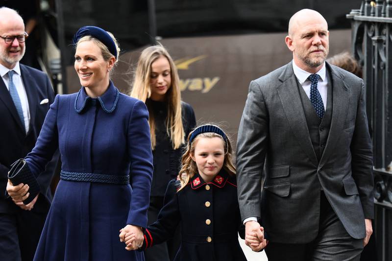 Zara Phillips, the queen's granddaughter, and her husband Mike Tindall arrive with their daughter Mia Grace. AFP