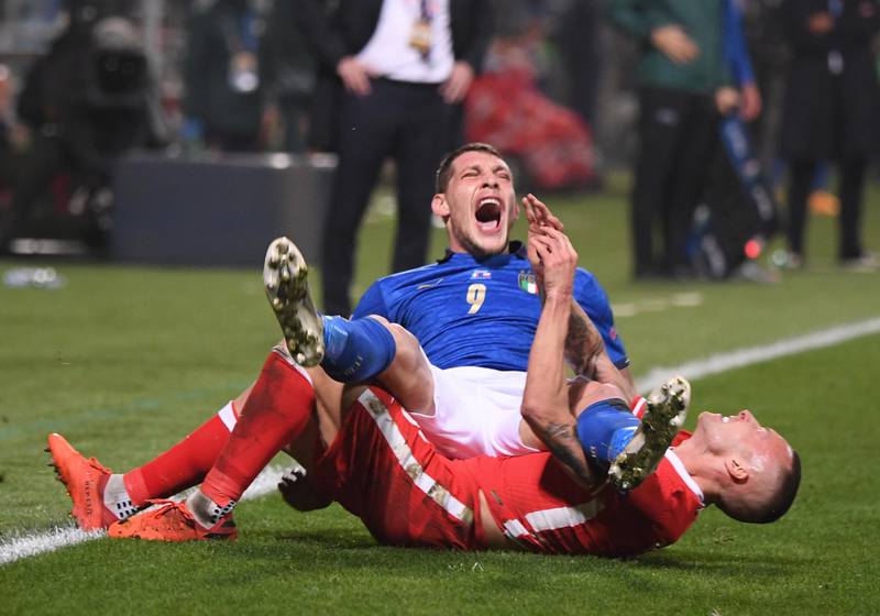 Italy's Andrea Belotti reacts after a challenge from Jacek Goralski of Poland during the Uefa Nations League game at the Mapei Stadium on Sunday, November 15. The Polish player was sent off as a result. Reuters
