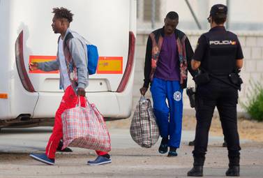 Migrants arrive from Lampedusa at the Centre for Temporary Assistance to Foreigners (CATE), disembarking from the Spanish military ship "Audaz" in the port of Algeciras in Campamento near San Roque on August 30, 2019. AFP