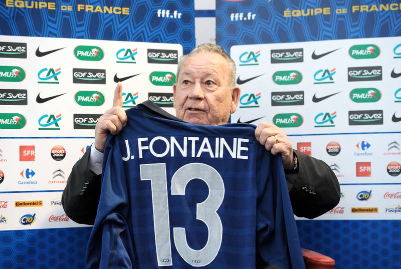 Just Fontaine in 2011 with a France jersey showing his goals tally at the 1958 World Cup. AFP