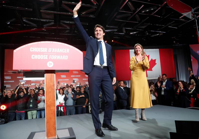 Liberal leader and Canadian Prime Minister Justin Trudeau and his wife Sophie Gregoire Trudeau wave to supporters after the federal election at the Palais des Congres in Montreal, Quebec, Canada October 22, 2019. REUTERS/Stephane Mahe