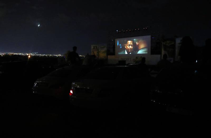 People watch a film on the first day of screening at a drive-in open air cinema at the Municipal car park of Sidi Bou Said in Tunis, Tunisia. All photos by EPA