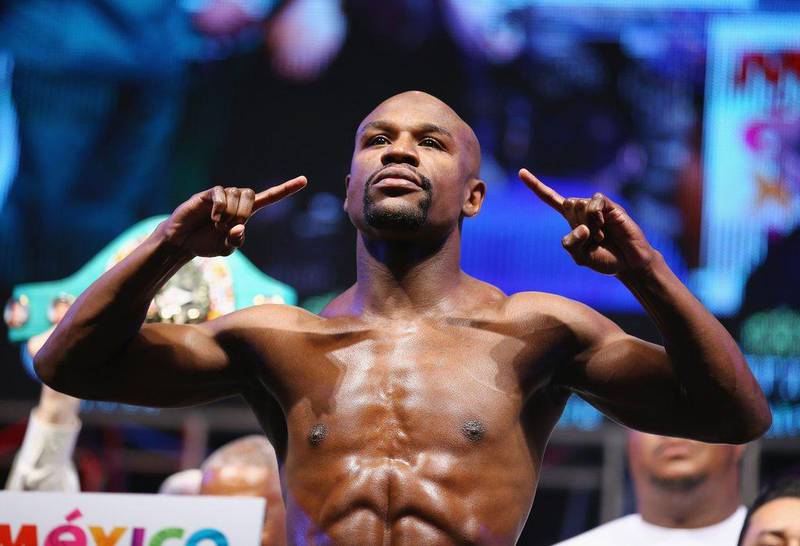 Floyd Mayweather poses during his official weigh-in on Friday for his Saturday night title fight against Marcos Maidana. Al Bello / Getty Images / AFP / September 12, 2014   