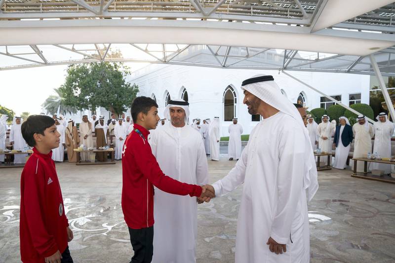 ABU DHABI, UNITED ARAB EMIRATES - December 23, 2019: HH Sheikh Mohamed bin Zayed Al Nahyan, Crown Prince of Abu Dhabi and Deputy Supreme Commander of the UAE Armed Forces (R) greets a member of Asian Muay Thai Championship 2019, during a Sea Palace barza.

( Mohamed Al Hammadi / Ministry of Presidential Affairs )
---