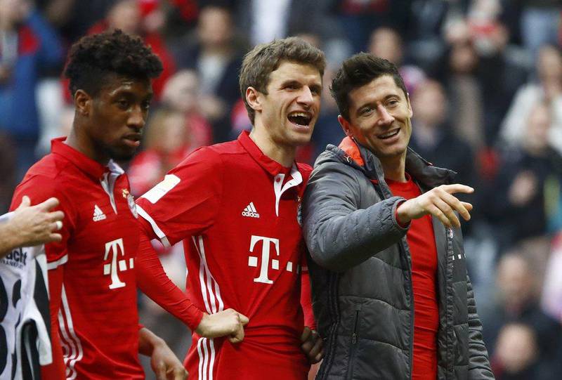 Bayern Munich's Robert Lewandowski, Thomas Muller and Kingsley Coman react at the end of the match. Wolfgang Rattay / Reuters
