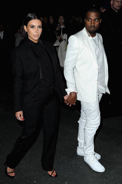 PARIS, FRANCE - MARCH 03:  Kim Kardashian and Kanye West attend Givenchy  Fall/Winter 2013 Ready-to-Wear show as part of Paris Fashion Week on March 3, 2013 in Paris, France.  (Photo by Pascal Le Segretain/Getty Images)