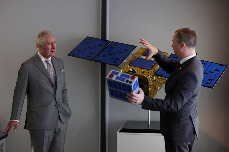 Prince Charles speaks to the Head of Operations at Astroscale, Al Colebourn. PA