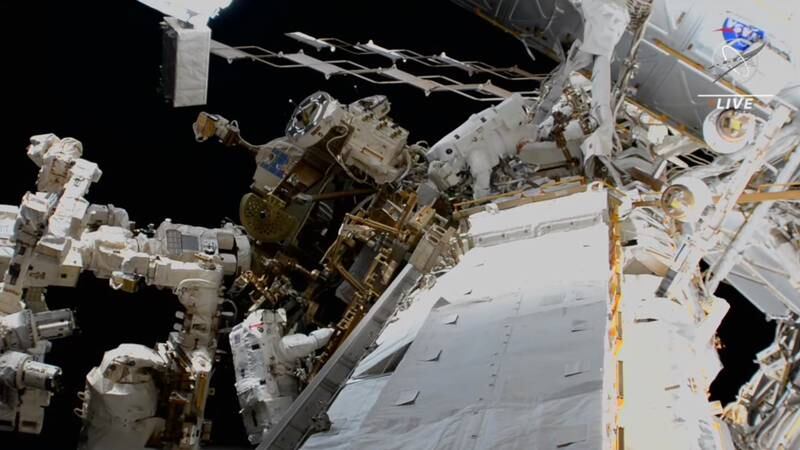 Dr Al Neyadi, top, carries out repairs outside the ISS