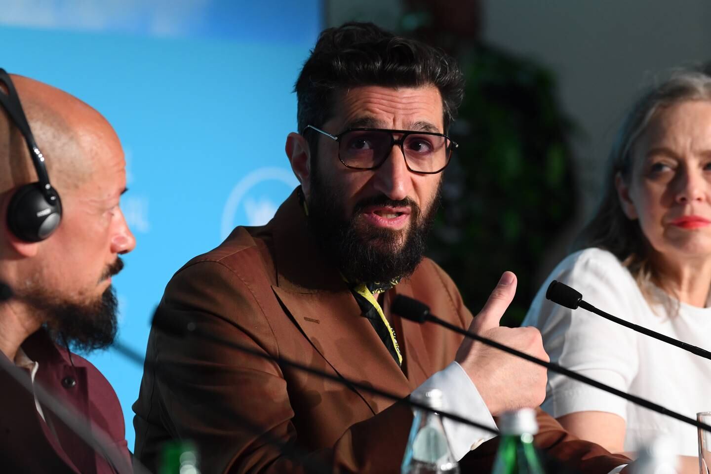 Tarik Saleh, left, and Fares Fares, centre, attend the press conference for 'Boy from Heaven' during the 75th Cannes Film Festival at Palais des Festivals. EPA