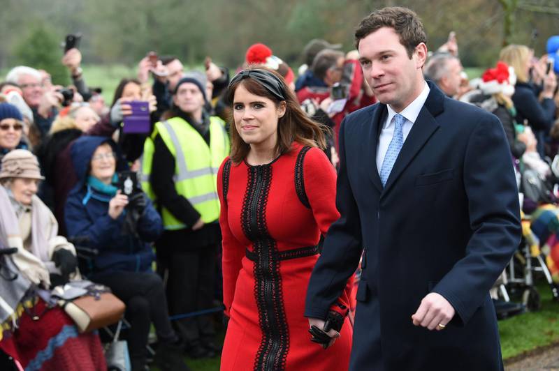 Britain's Princess Eugenie of York (L) and her husband Jack Brooksbank arrive for the Royal Family's traditional Christmas Day service at St Mary Magdalene Church in Sandringham, Norfolk, eastern England.